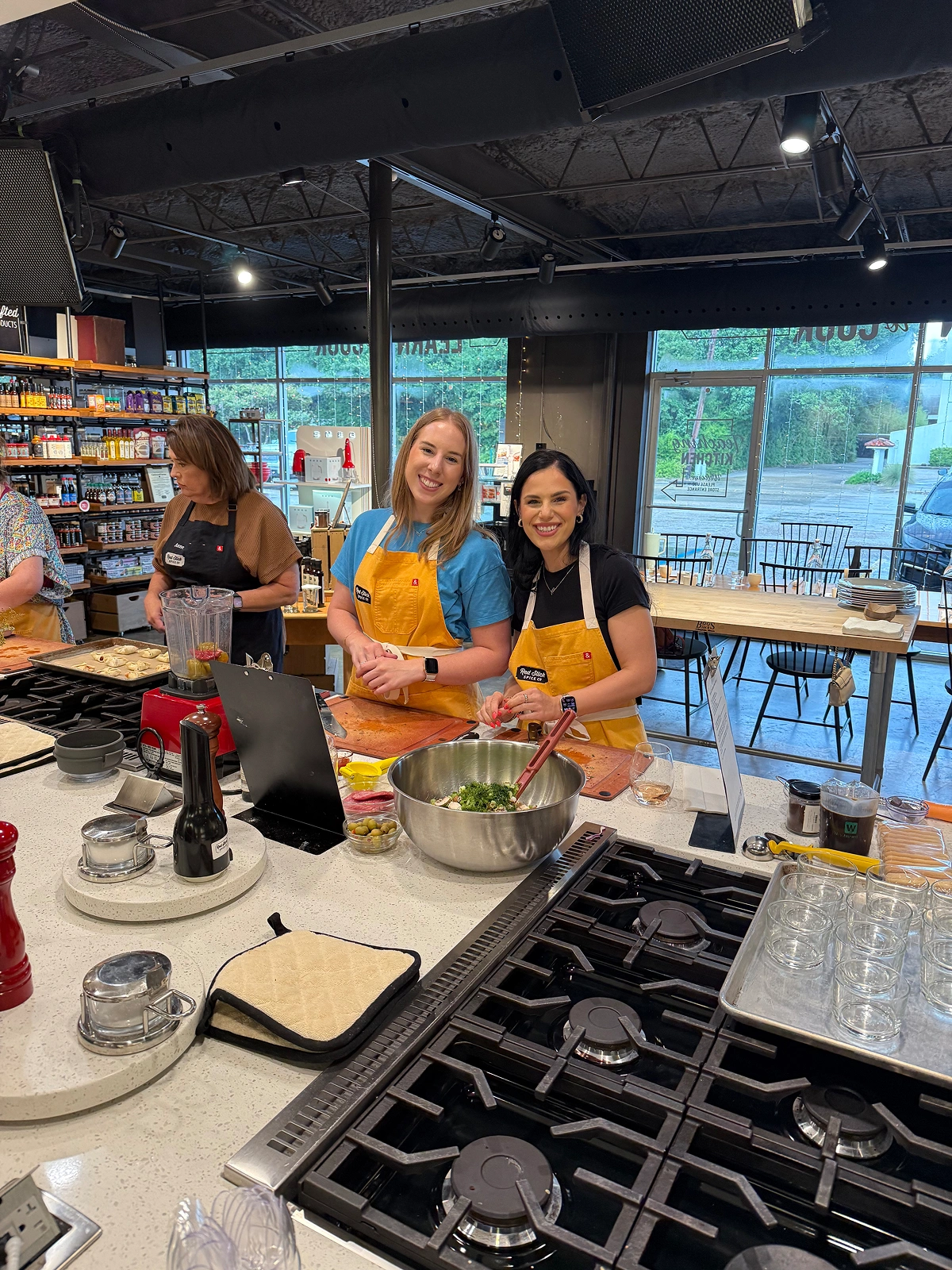 Team members preparing food together in a kitchen