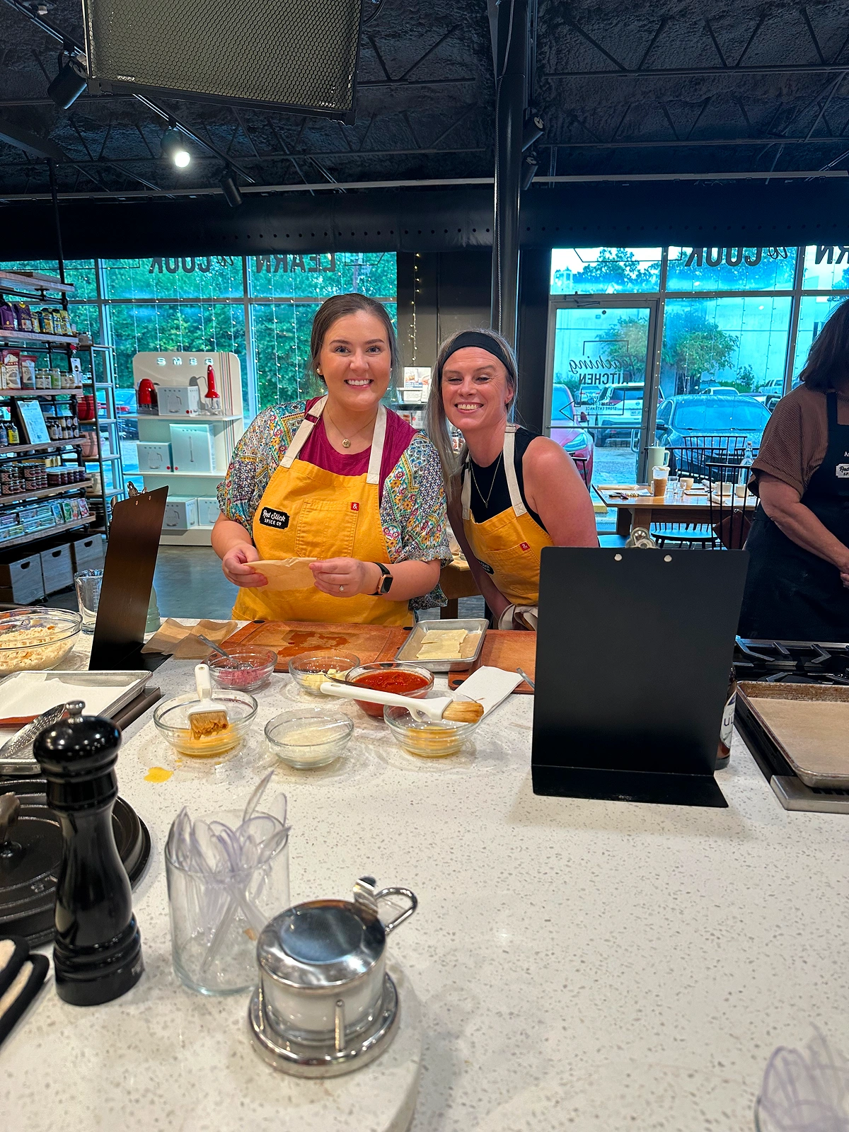Team members preparing food together in a kitchen
