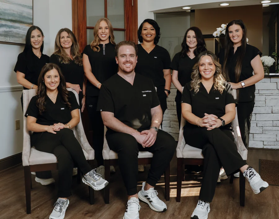 Dental team posing together for a group photo inside the dental office